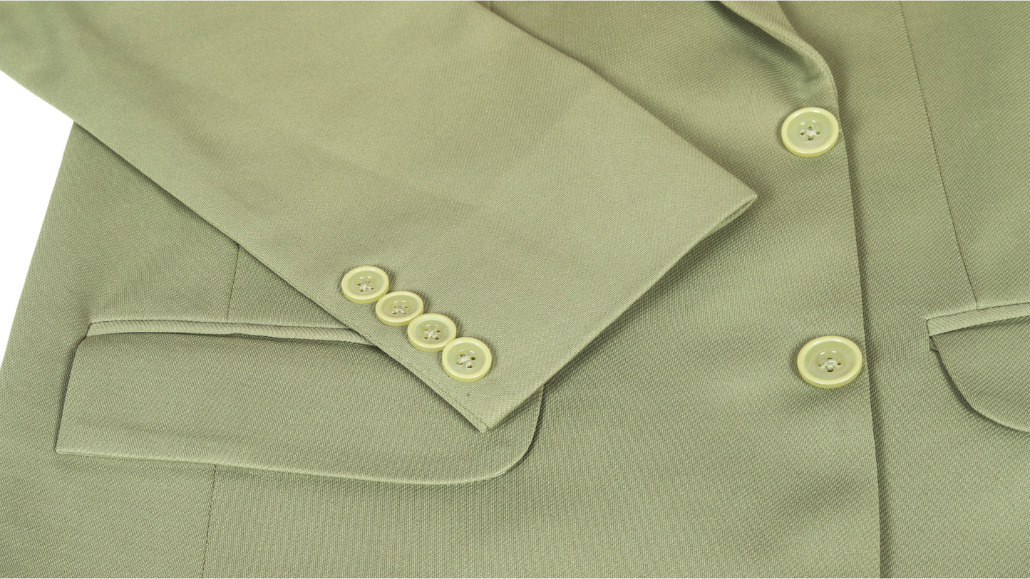 Close-up of a green coat jacket with buttons on a white background