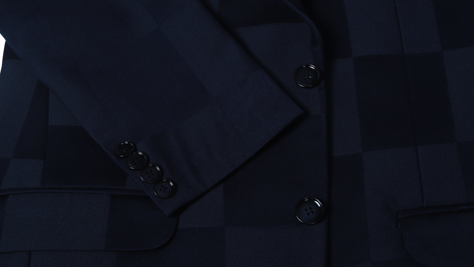 Close-up of a dark blue check coat with buttons