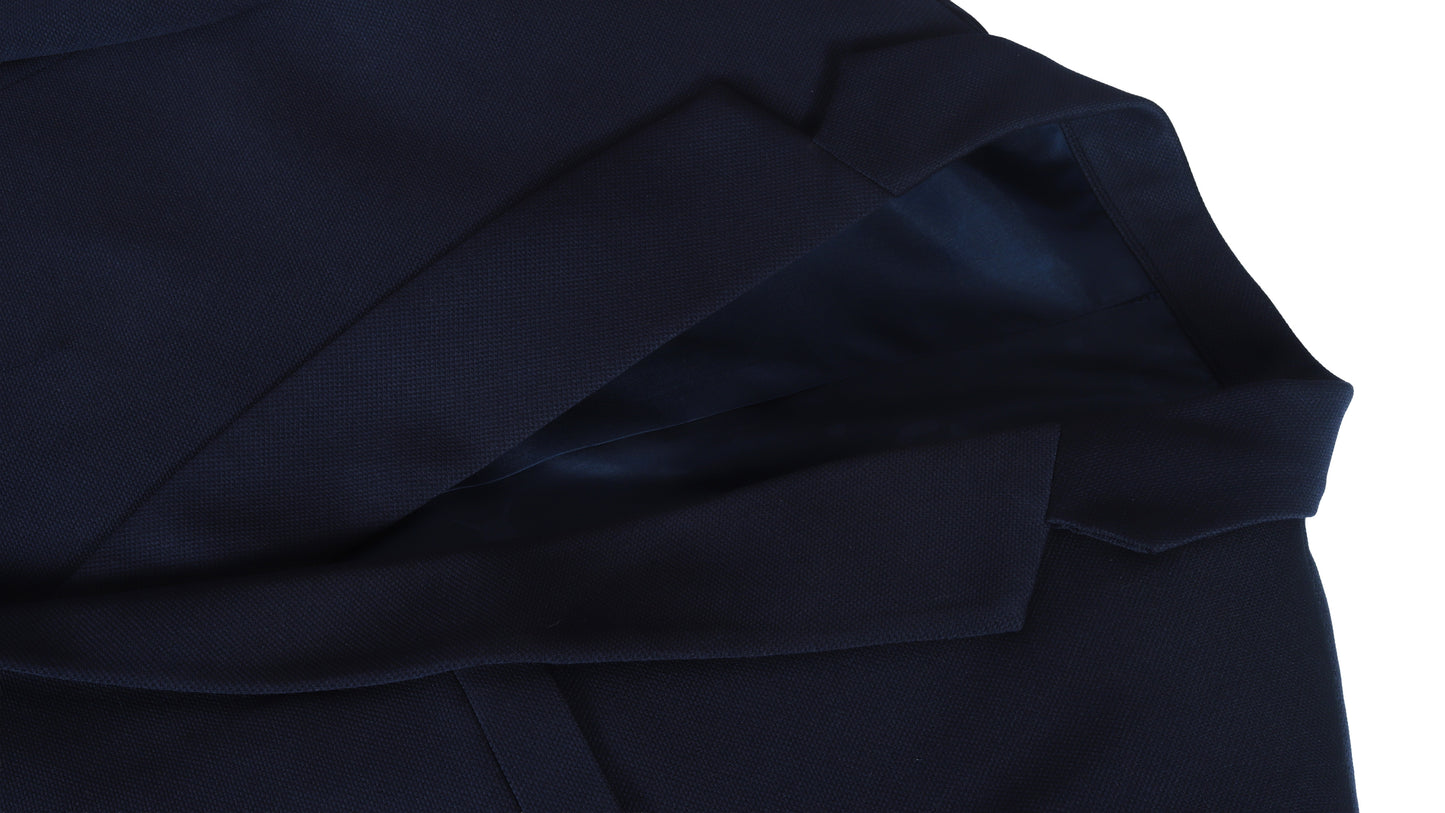 Close-up of a dark blue coat fabric texture on a white background