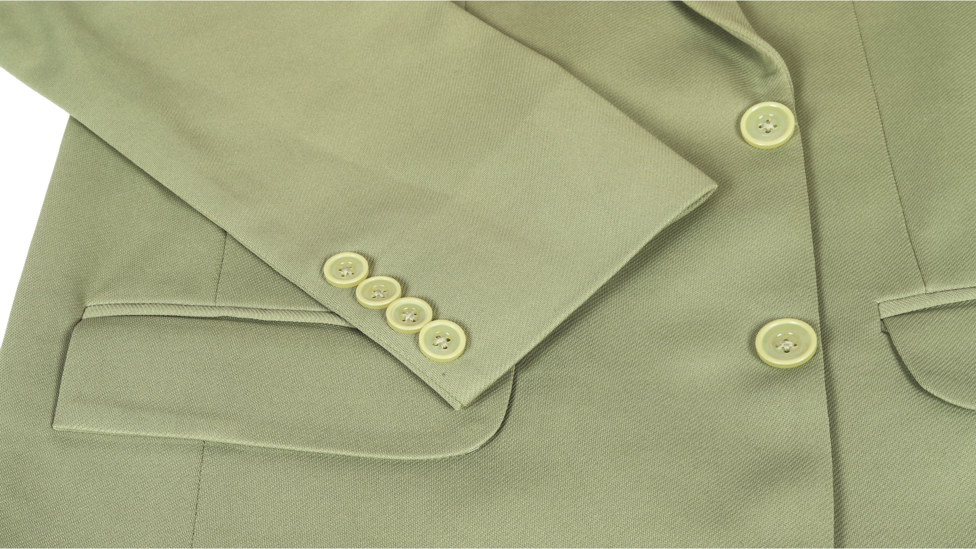 Close-up of a green coat jacket with buttons on a white background