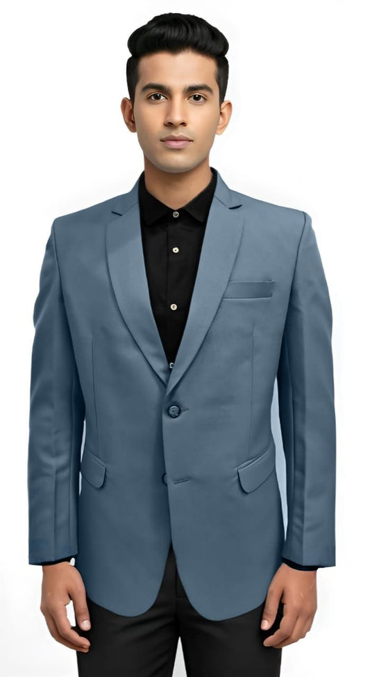 Man wearing a blue blazer over a black shirt on a white background